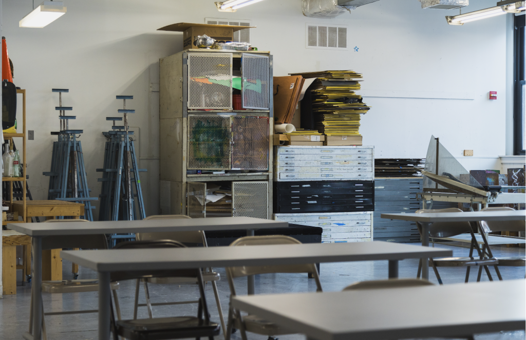 Image of a classroom space in Art and Exhibition Hall with easels, tables, and other art supplies.